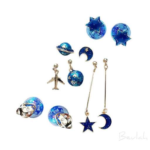 a set of earrings and earrings with a moon and starfish.