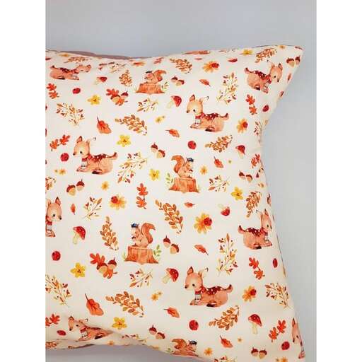 a pretty floral pillow cover in orange and yellow.