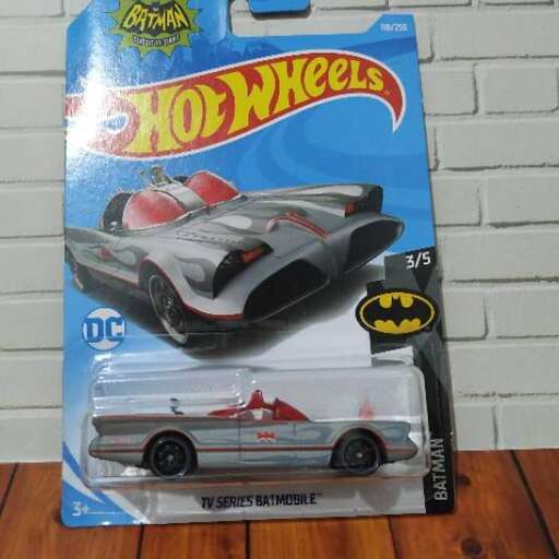 a toy car and a toy car in a box.