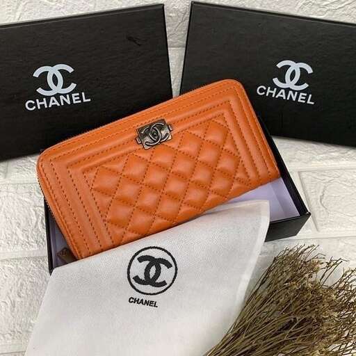 a wallet with a logo on it and a white bag on the side.