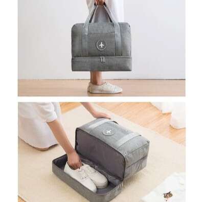 a woman is putting her shoes in a suitcase.