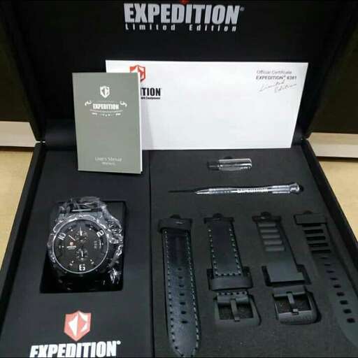 a black case with a watch and a card