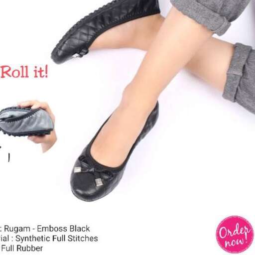 a woman's black high heeled shoes with a flat heel.