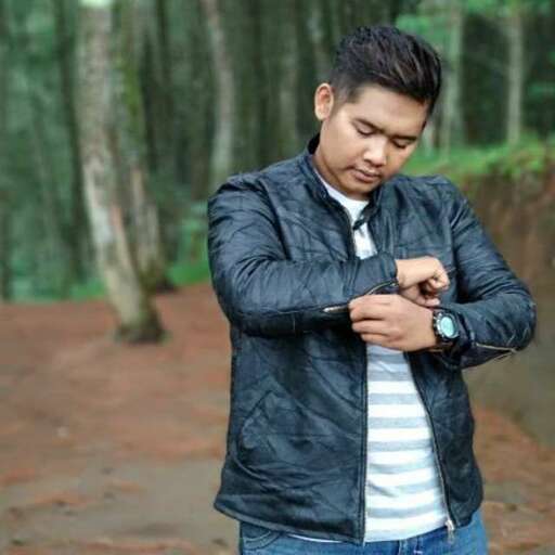 a man wearing a leather jacket and jeans.