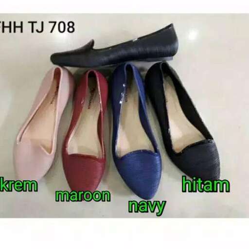 a pair of blue shoes with a black bow.