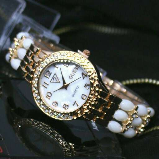 a watch with a gold band