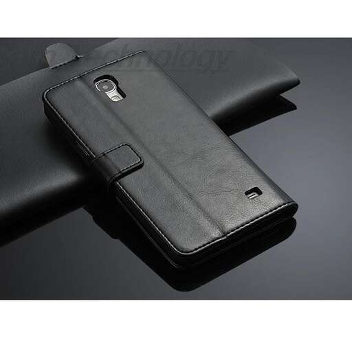 a black cell phone case sitting on a table.