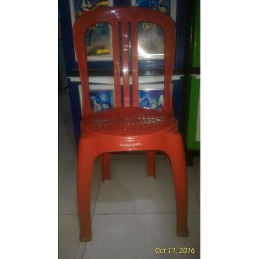 a red chair sitting in a store