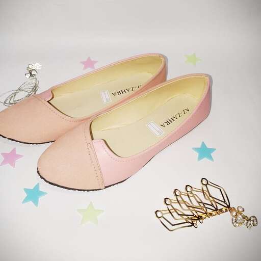 a pair of pink shoes and gold chain.