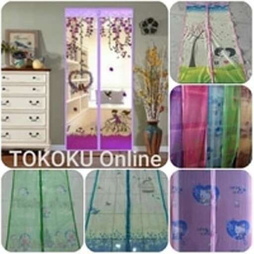 a room with a colorful bedding and a vase of flowers.