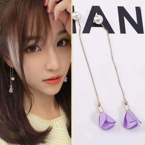 a set of earrings with a flower