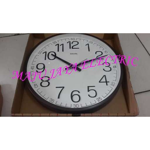 a large clock with a black frame and a white face.
