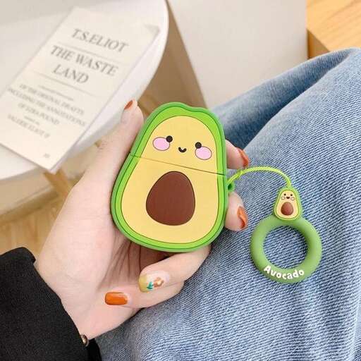 a woman holding a green toy with a green handle.