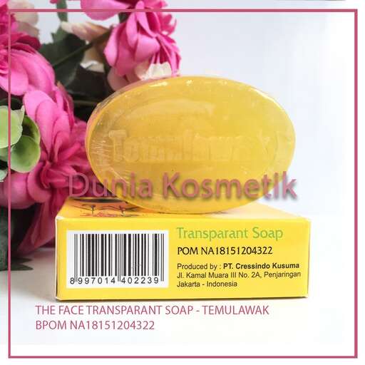 a soap dispenser with flowers in it