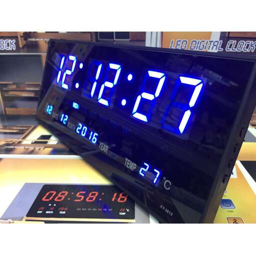 a digital clock with blue numbers and numbers.