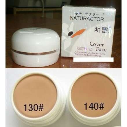 a white oval container with a brown lid.