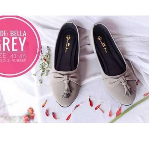 a pair of black leather shoes with a floral pattern.
