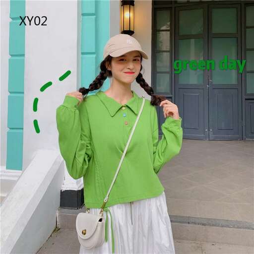 a green sweater with a white skirt and a white skirt.