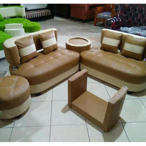 a living room with a couch and ottoman.