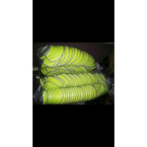 a pair of plastic bags with a yellow and green pattern.