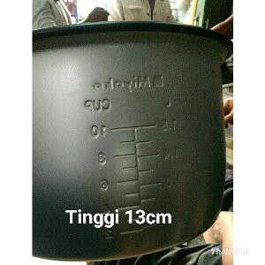 a black pot with a cup in it