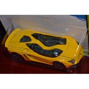 rear view of the yellow car with black trim. the yellow body is a little over the top.