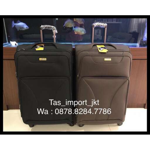 two suitcases are sitting next to each other.