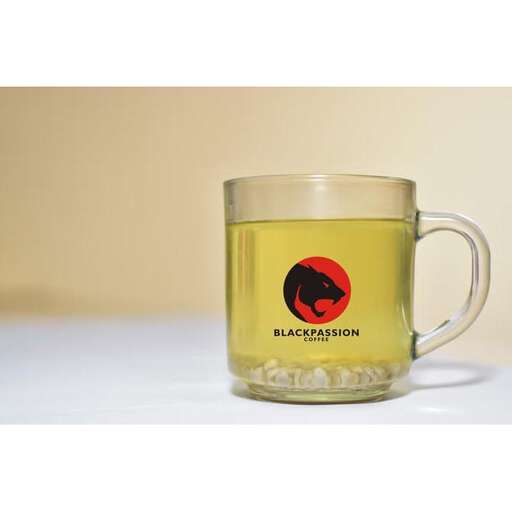 a mug of tea with a red logo.