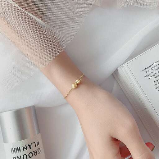 a gold bracelet with a little bit of gold.