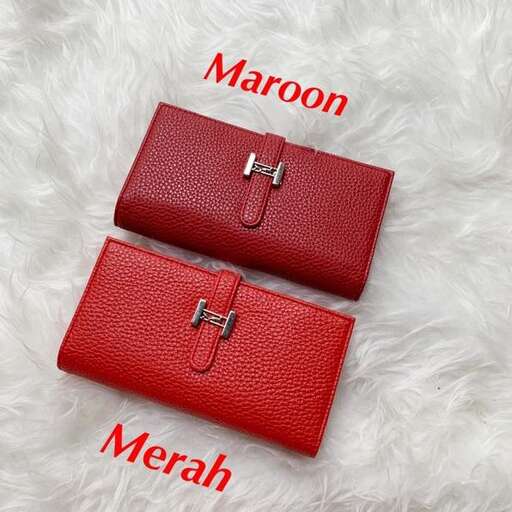 a red leather wallet with a zipper and a zipper.