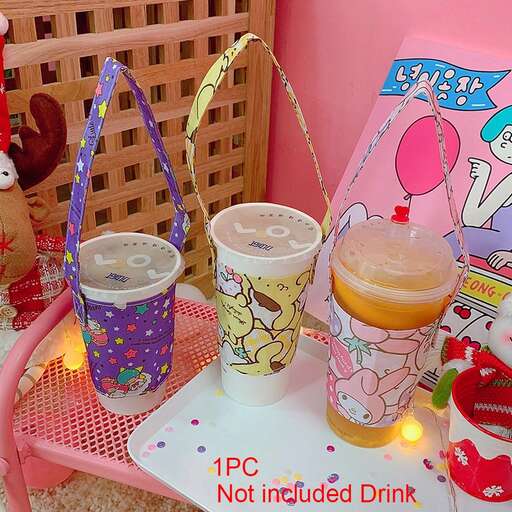 a table with two cups and a drink on it.