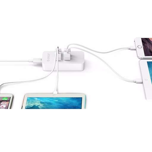 a white ipod charging with a white charger.