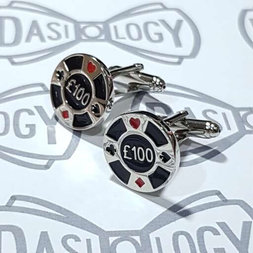 a pair of keys with a slot machine in the background.