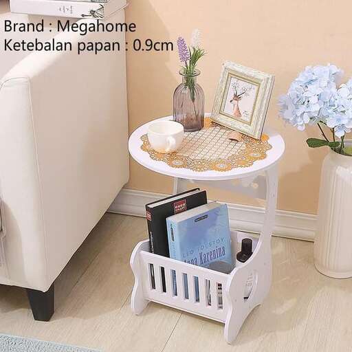 a laundry basket with books and a vase on a table.