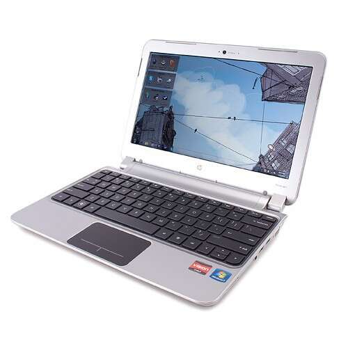 a laptop computer with a picture of a building in the background.