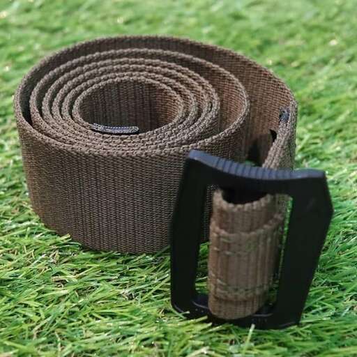 a belt that is rolled up and a belt is on the grass.