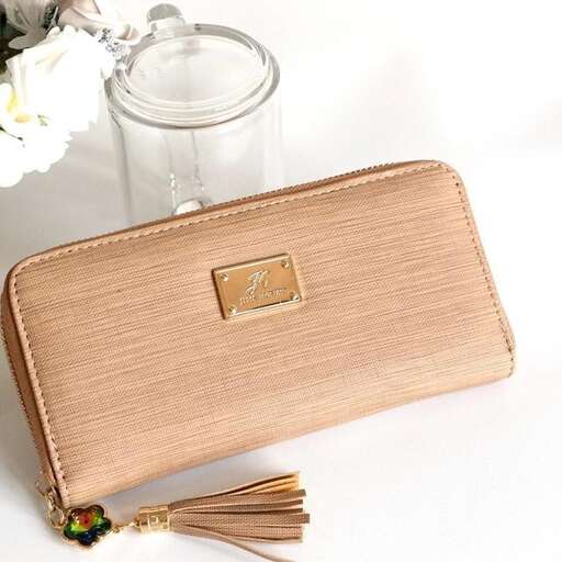 a brown purse with a glass jar and a glass jar.