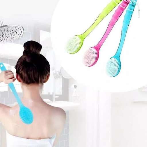 a woman brushing her teeth in the bathroom.