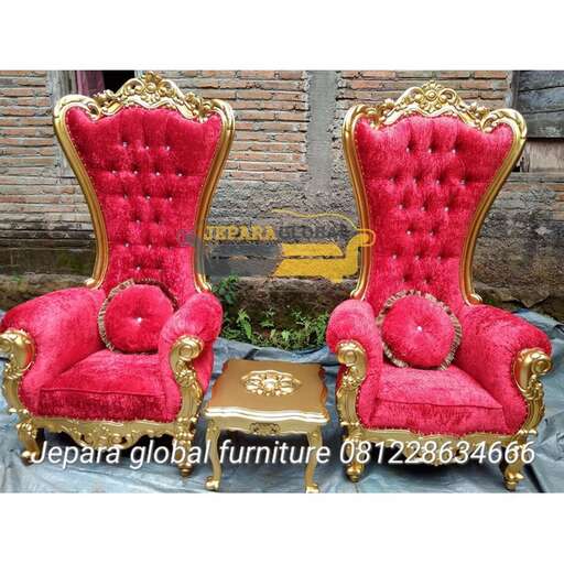 a pair of red and gold chairs.