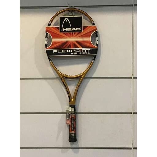 a tennis racket hanging on a wall.