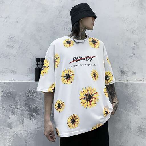 a white shirt with yellow flowers on the front and a black hat.