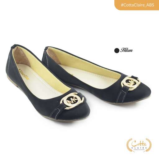 womens black flat shoes with a gold design