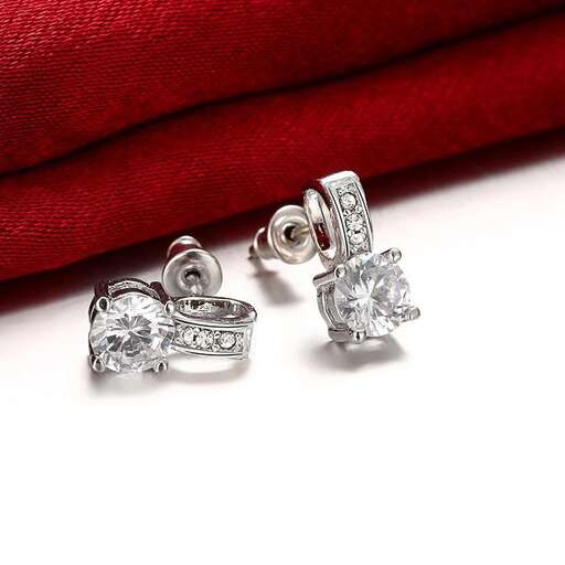 a pair of diamond and diamond earrings