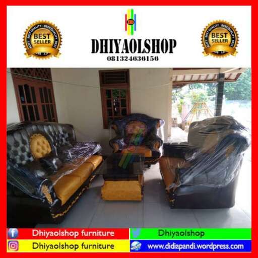 a living room with a couch, chair, and a window.