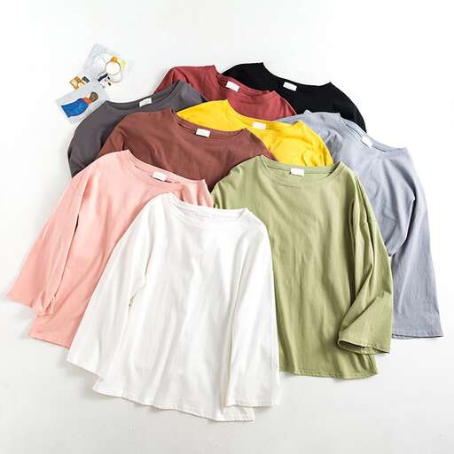 a pile of clothes sitting on top of a pile of clothes.