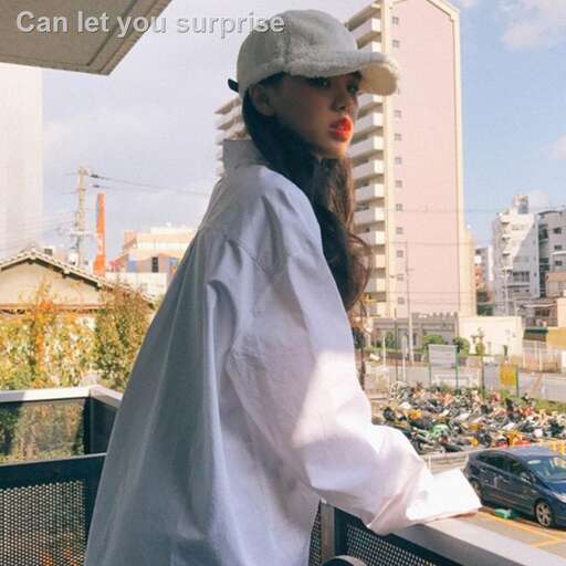 person in a white shirt and hat