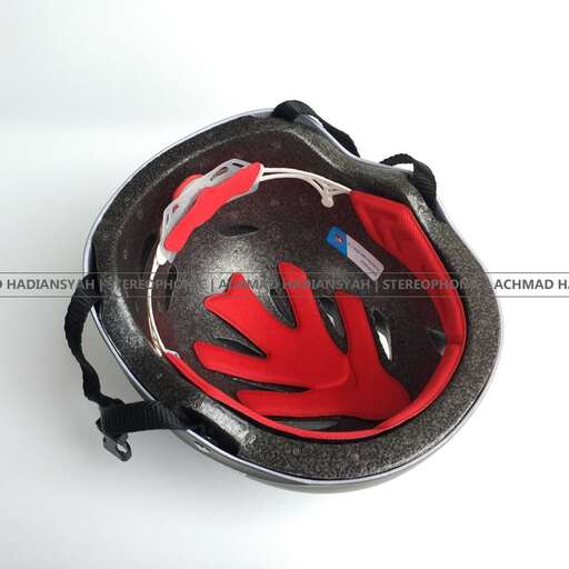 a helmet with a red handle.