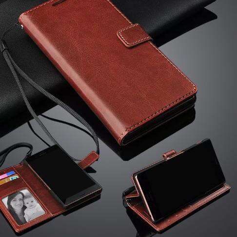 a leather wallet with a picture of a woman inside.