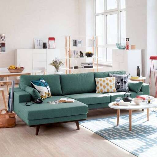 a living room with a couch, table and chairs.