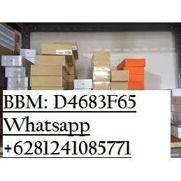 a box of boxes and a phone number on a shelf.